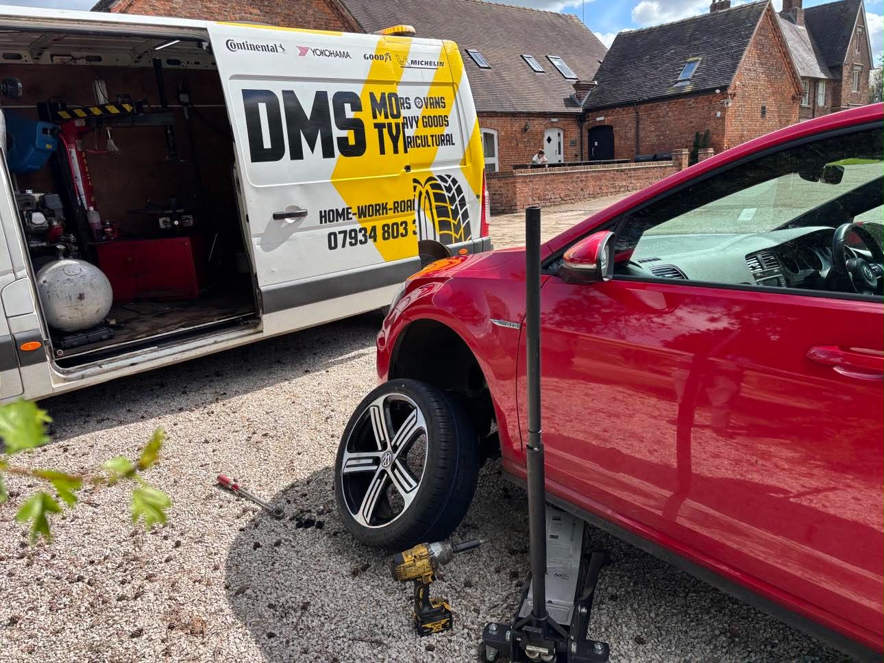 DMS Tyres mobile tyre fitter fitting a tyre in Ashbourne