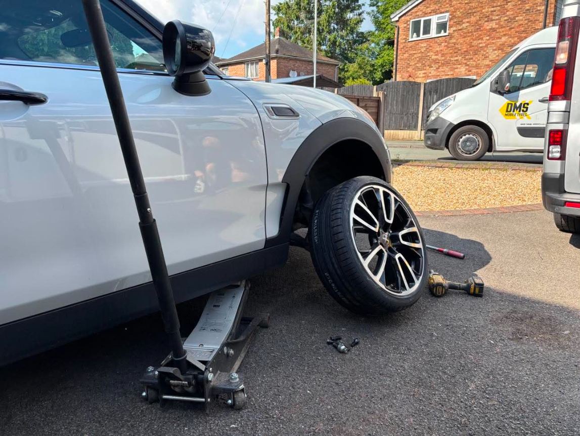 DMS Tyres mobile tyre fitter fitting a tyre in Blythe Bridge