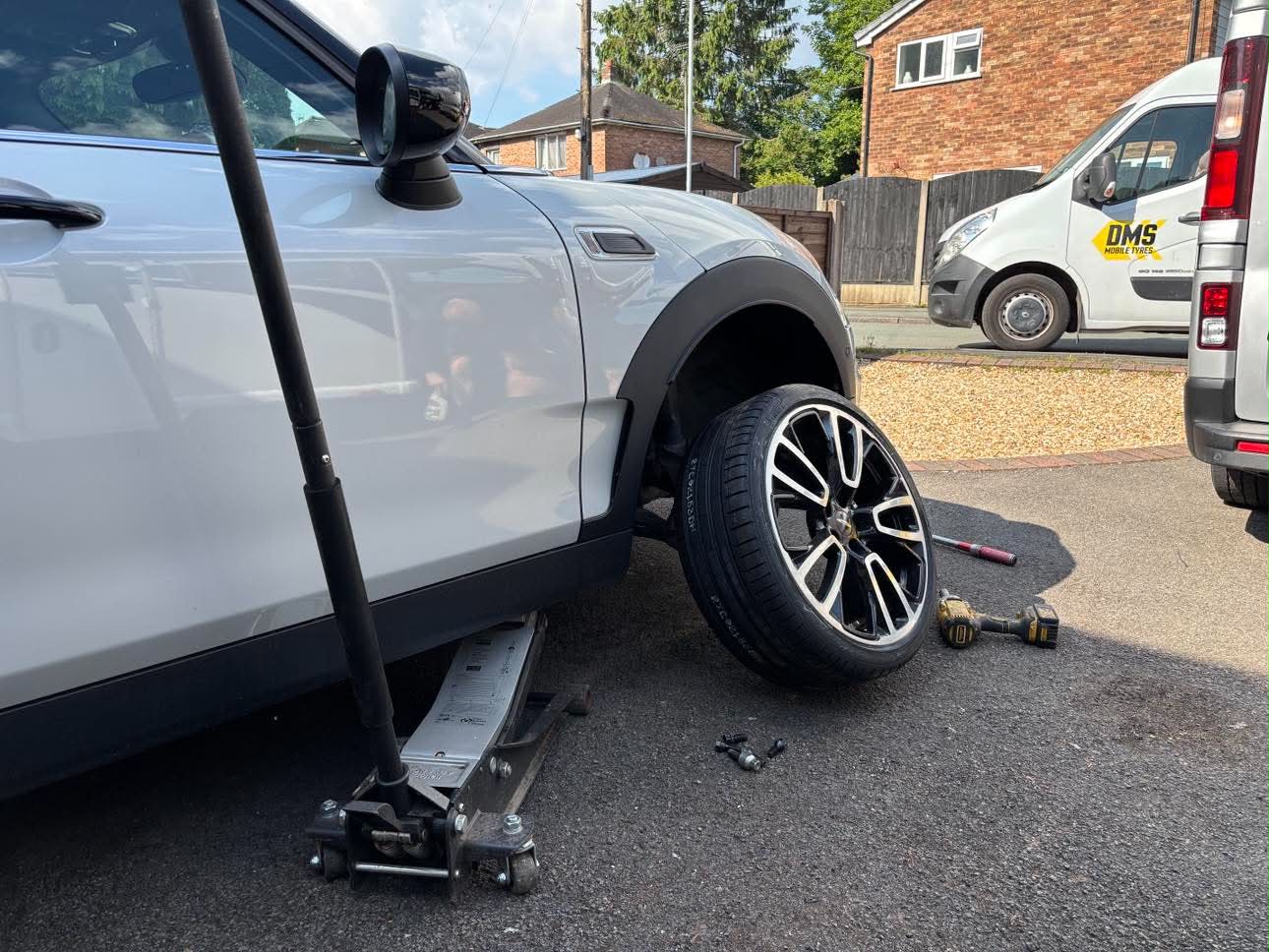DMS Tyres mobile tyre fitter fitting a tyre in Blythe Bridge