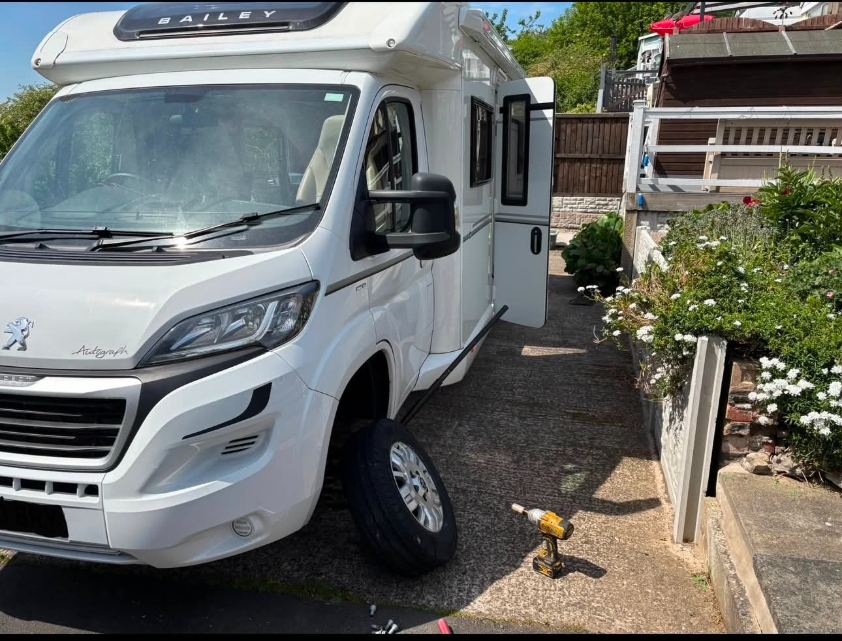 Bailey Autograph motorhome on a driveway with the front wheel removed