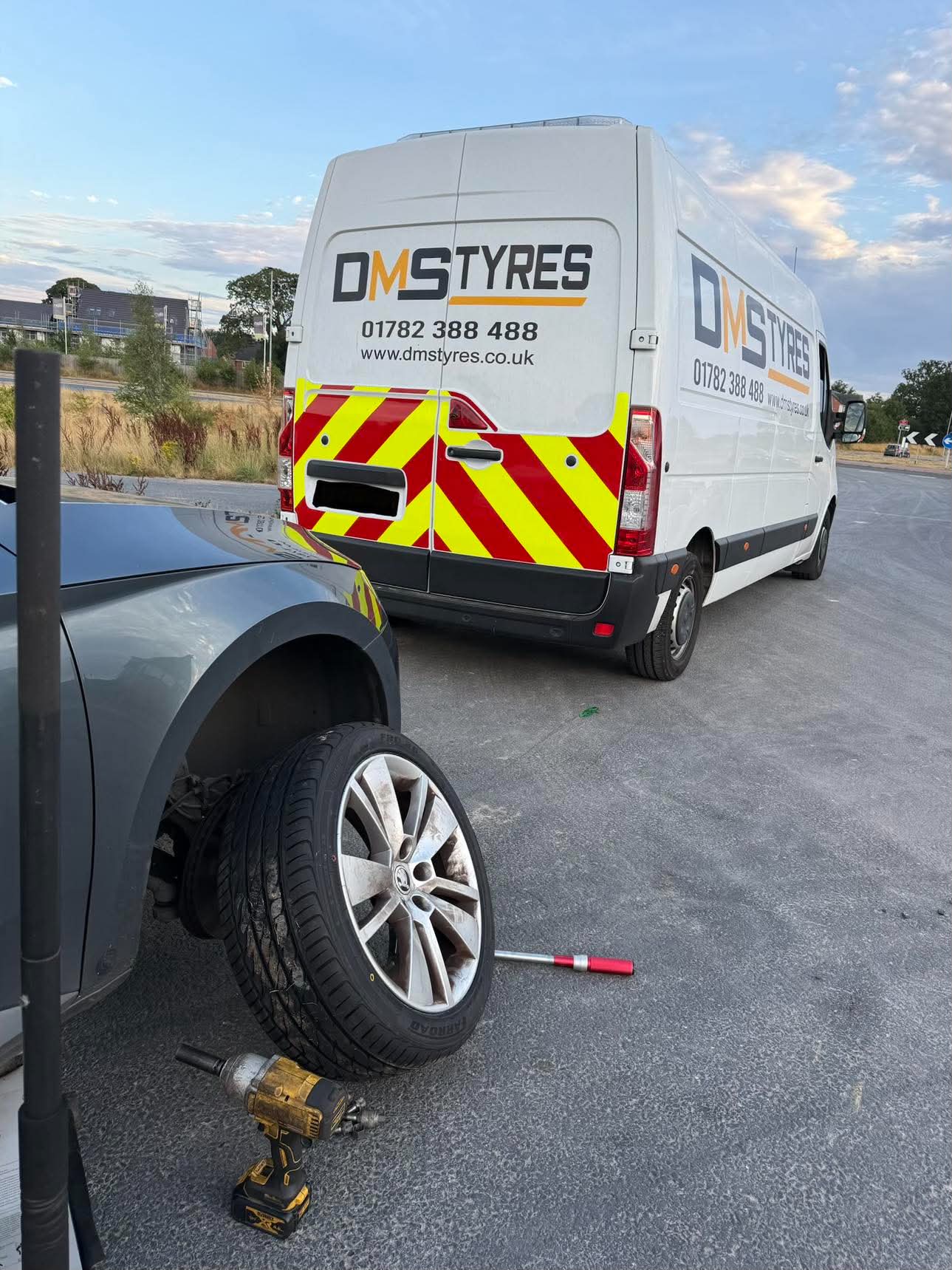 DMS Tyres mobile tyre fitter fitting a tyre in Congleton