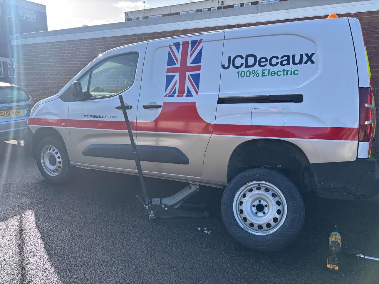 DMS Tyres fitter changing a tyre on a fleet van at a customer site