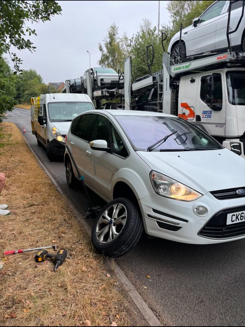 Roadside tyre change on the A500 in Stoke-on-Trent with the DMS van behind