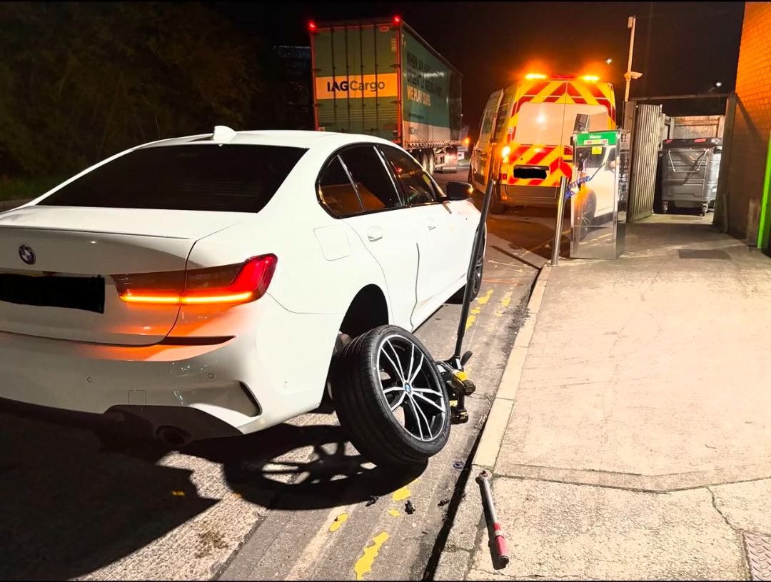 Night-time tyre change at M6 junction 19 services with the DMS Tyres van alongside