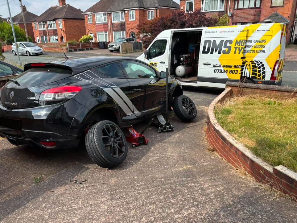 DMS Tyres mobile tyre fitter fitting a tyre in Newcastle-under-Lyme