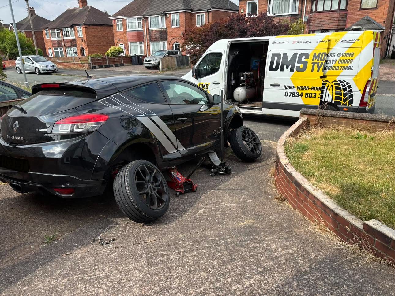 DMS Tyres mobile tyre fitter fitting a tyre in Newcastle-under-Lyme