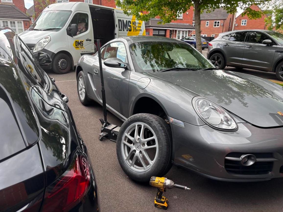 DMS Tyres mobile tyre fitter fitting a tyre in Northwich