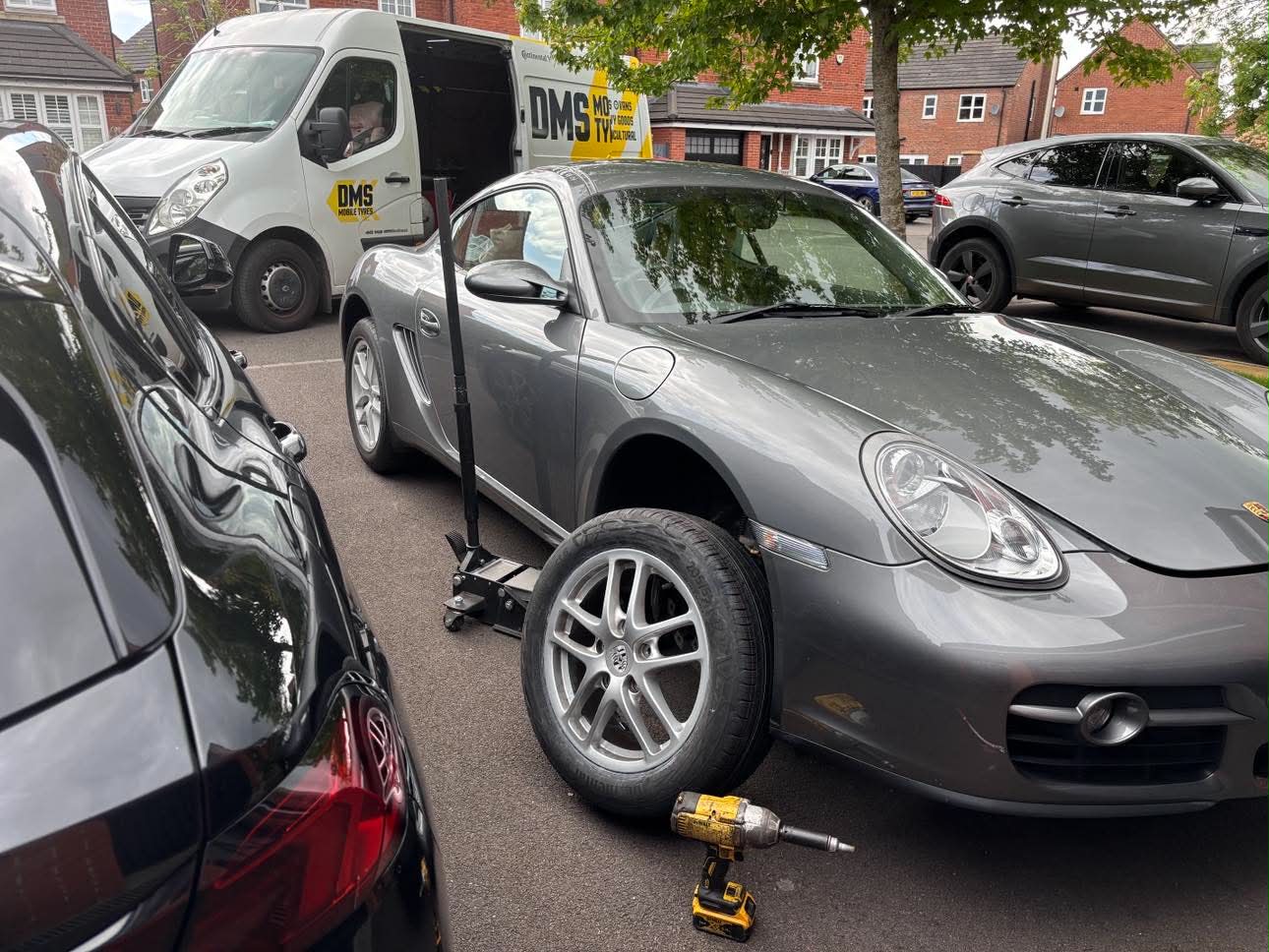 DMS Tyres mobile tyre fitter fitting a tyre in Northwich