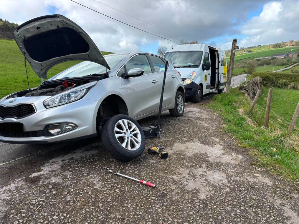 DMS Tyres mobile tyre fitter fitting a tyre in the Peak District