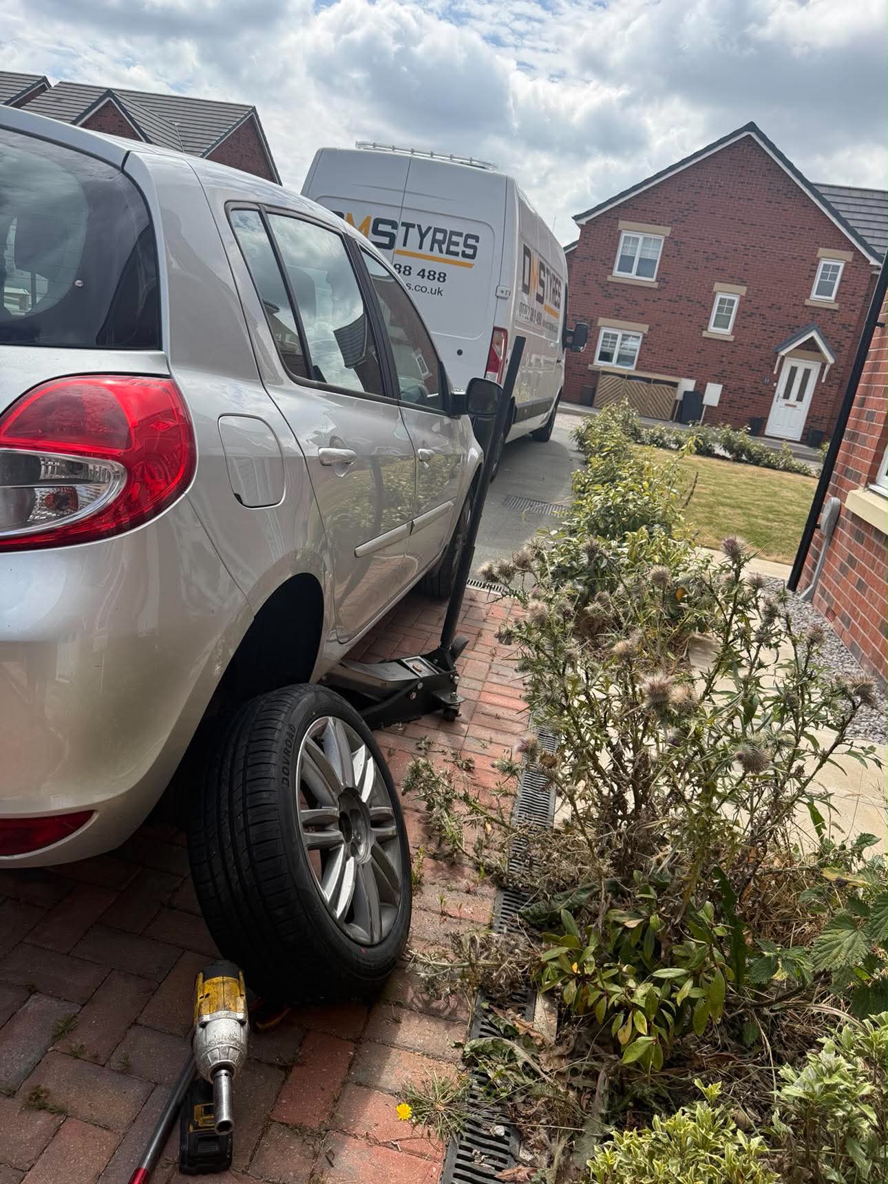 DMS Tyres mobile tyre fitter fitting a tyre in Stone
