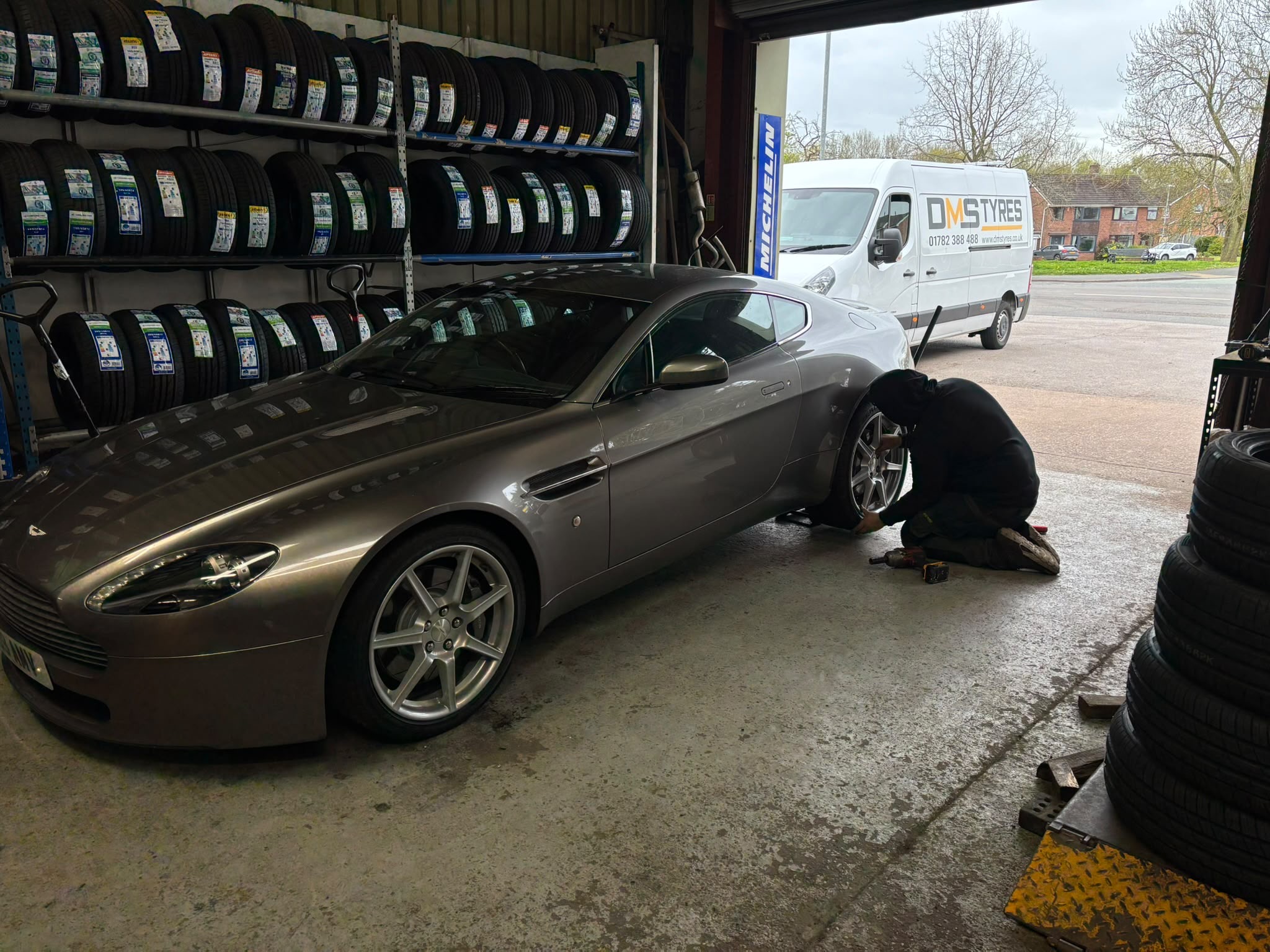 DMS technician fitting a tyre