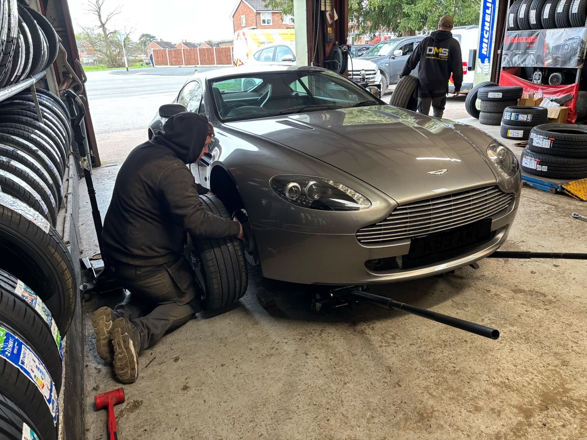 Technician fitting tyres in the workshop